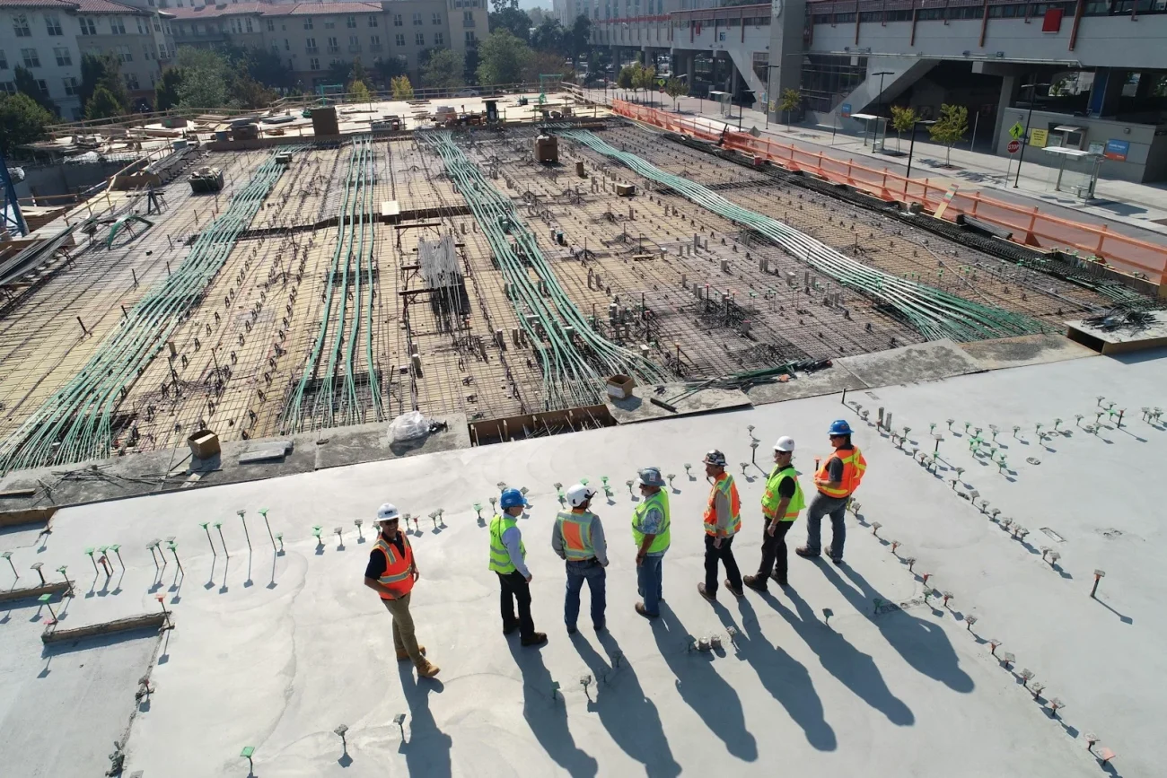 graduate engineer人工 seven construction workers standing on white field